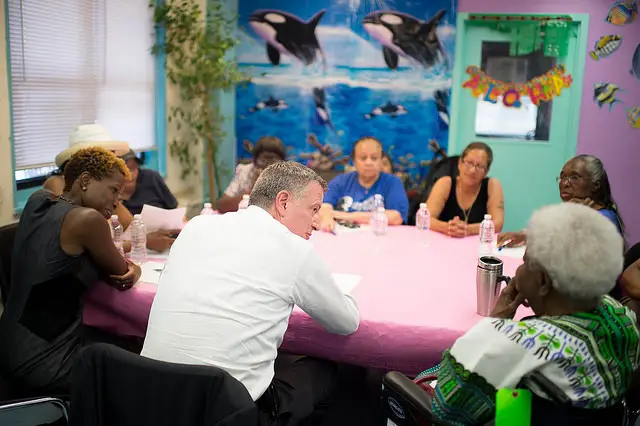 Mayor de Blasio meets with community leaders at the Wagner Houses.
